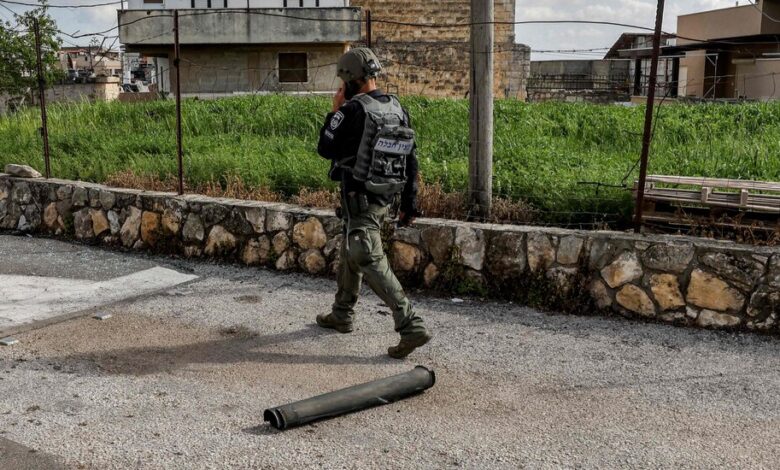 Lebanese militiamen fire rockets at Israel after raid on Al Aqsa . mosque