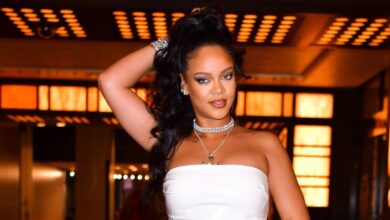 Rihanna shows off her pregnant belly in an all-white ensemble in a surprise appearance