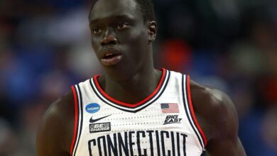 West Virginia's Akok Akok hospitalized after collapsing on court