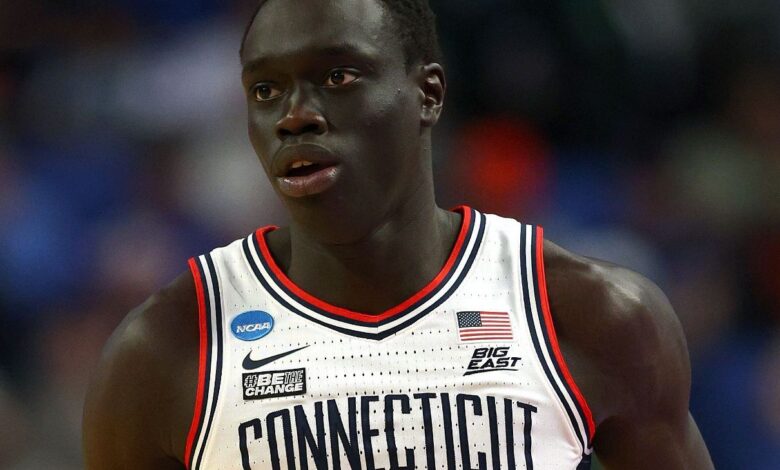 West Virginia's Akok Akok hospitalized after collapsing on court