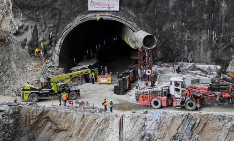 Indian rescuers break through tunnel debris to evacuate trapped workers