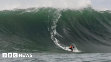 Surfers take on giant waves as storm hits California
