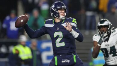 Lock, filling in for Smith, leads Seahawks to emotional win