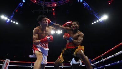 Raymond Ford defeated Otabek Kholmatov in the 12th round to win the WBA Featherweight title