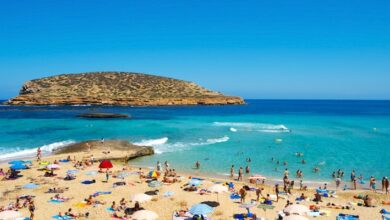 People enjoying the beach in Ibiza, Spain