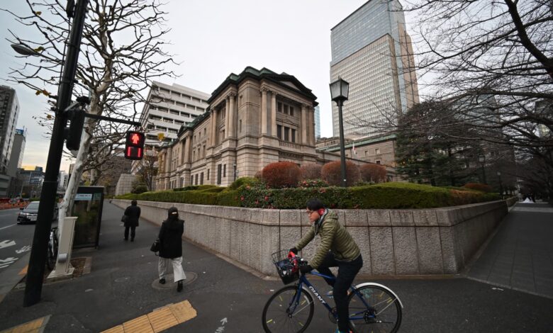 BOJ raises benchmark interest rate, outlines roadmap to cut bond-buying program