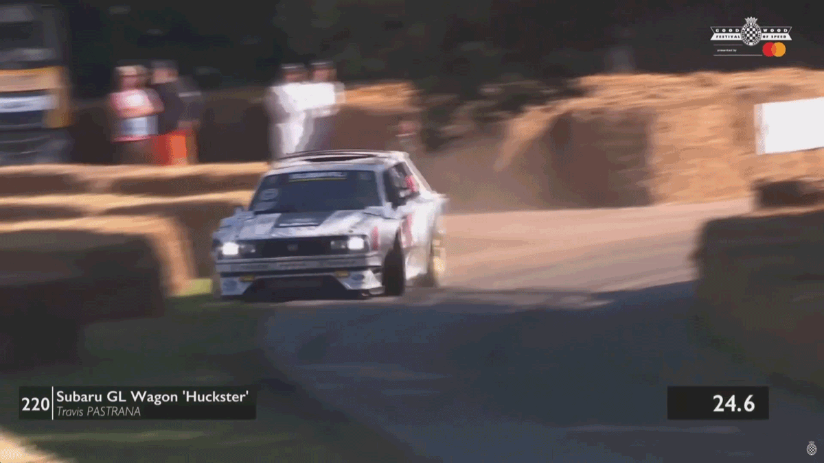 Travis Pastrana shows off and crashes Subaru GL 'Family Huckster' at Goodwood race